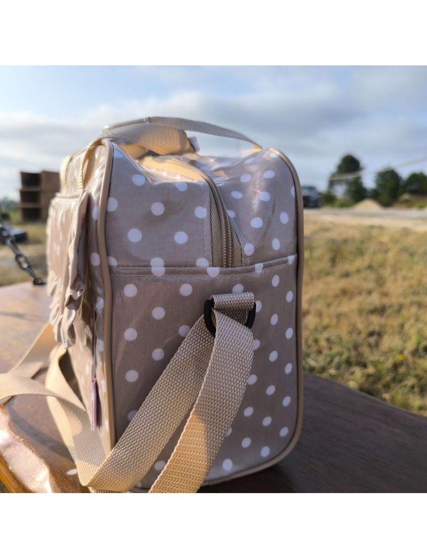 Lancheira bege com bolas brancas