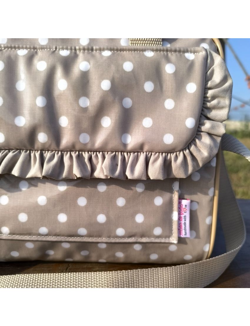 Lancheira bege com bolas brancas