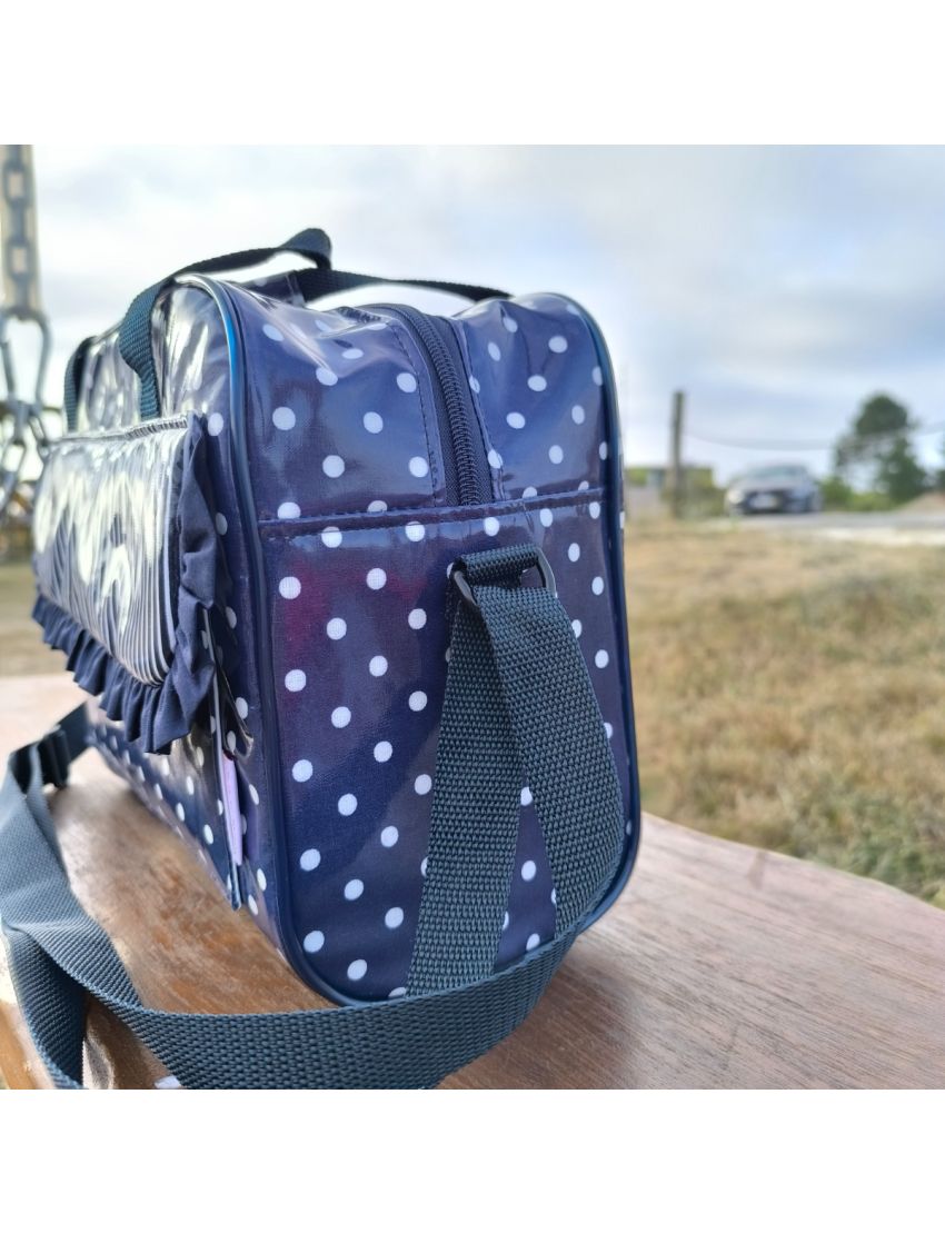 Lancheira azul com bolas brancas