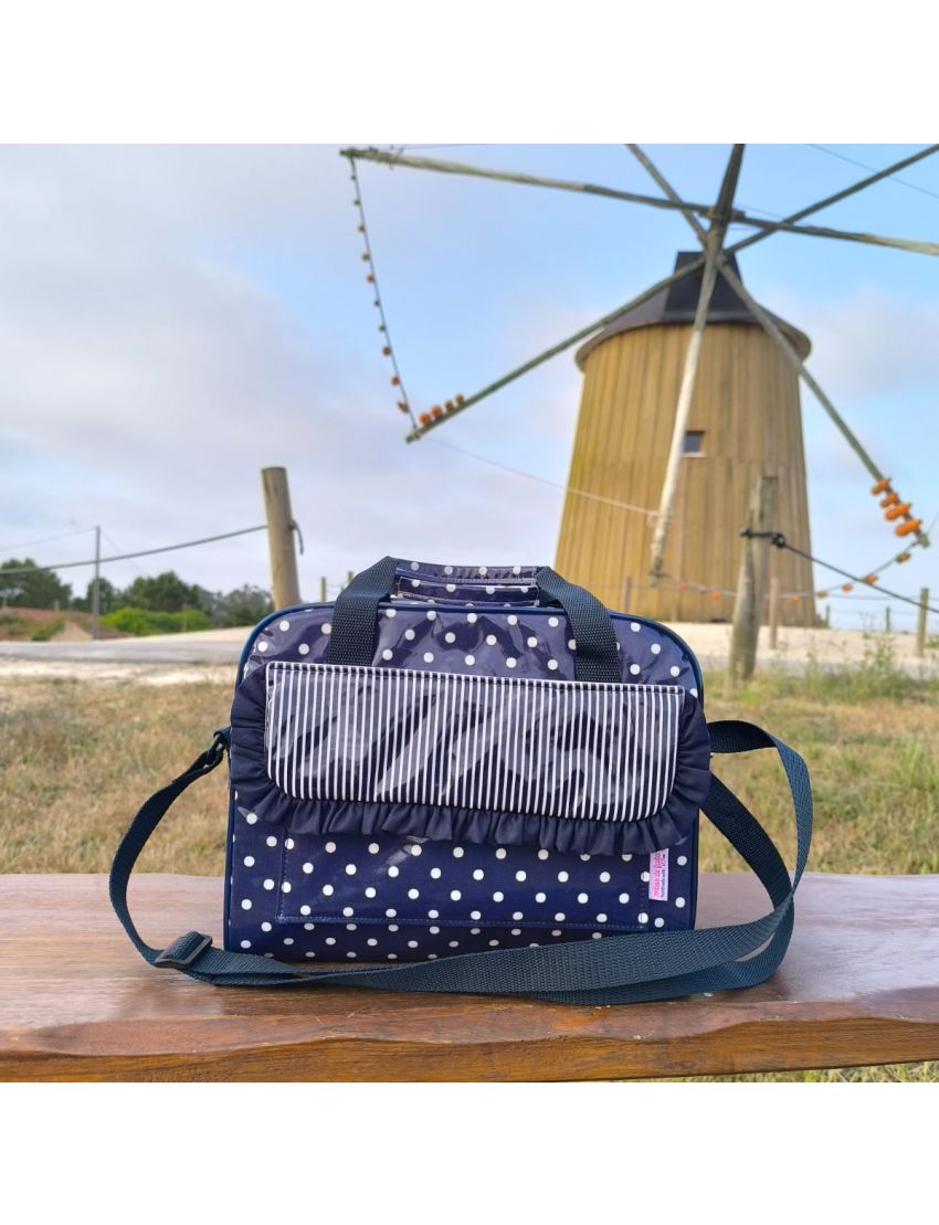 Lancheira azul com bolas brancas